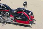The Yamaha's bags are sensible and stylish. Tucked in front of the left bag is a helmet lock, but the shape of the bag and seat prevent the lock's use. The Yamaha's bags are sensible and stylish. Tucked in front of the left bag is a helmet lock, but the shape of the bag and seat prevent the lock's use.
